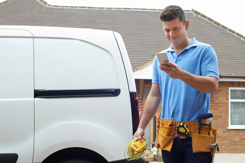 person stood next to a small van