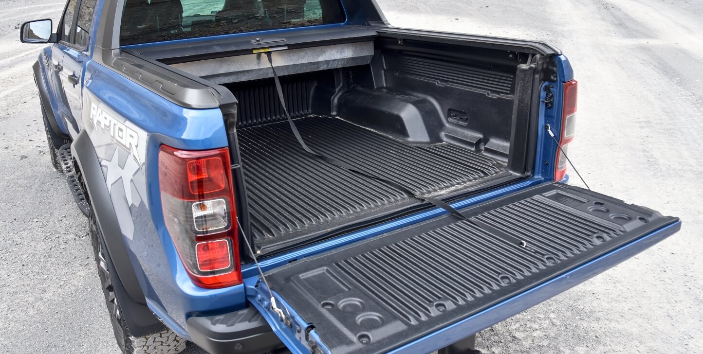 shutterstock_1679661433 blue ford ranger raptor with open truck