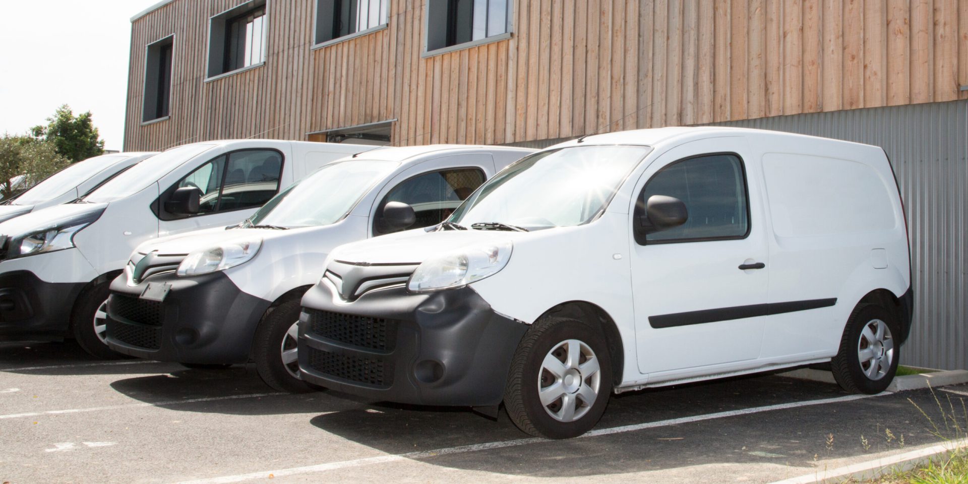 group of white small vans